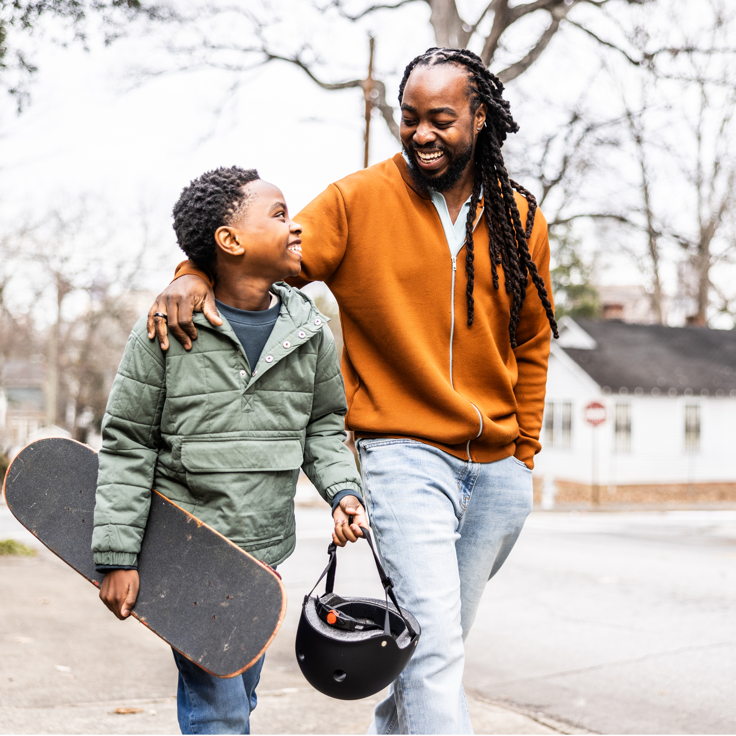 Father And Son Doing Skateboard