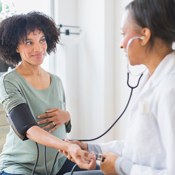 Prenatal doctor performing a checkup on patient