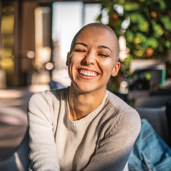 Person smiling sitting outside